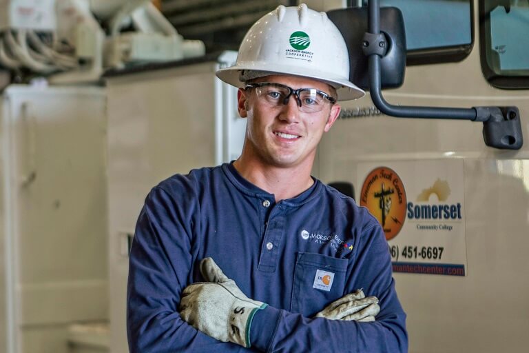 soldiers out side talking. Some sitting on bench