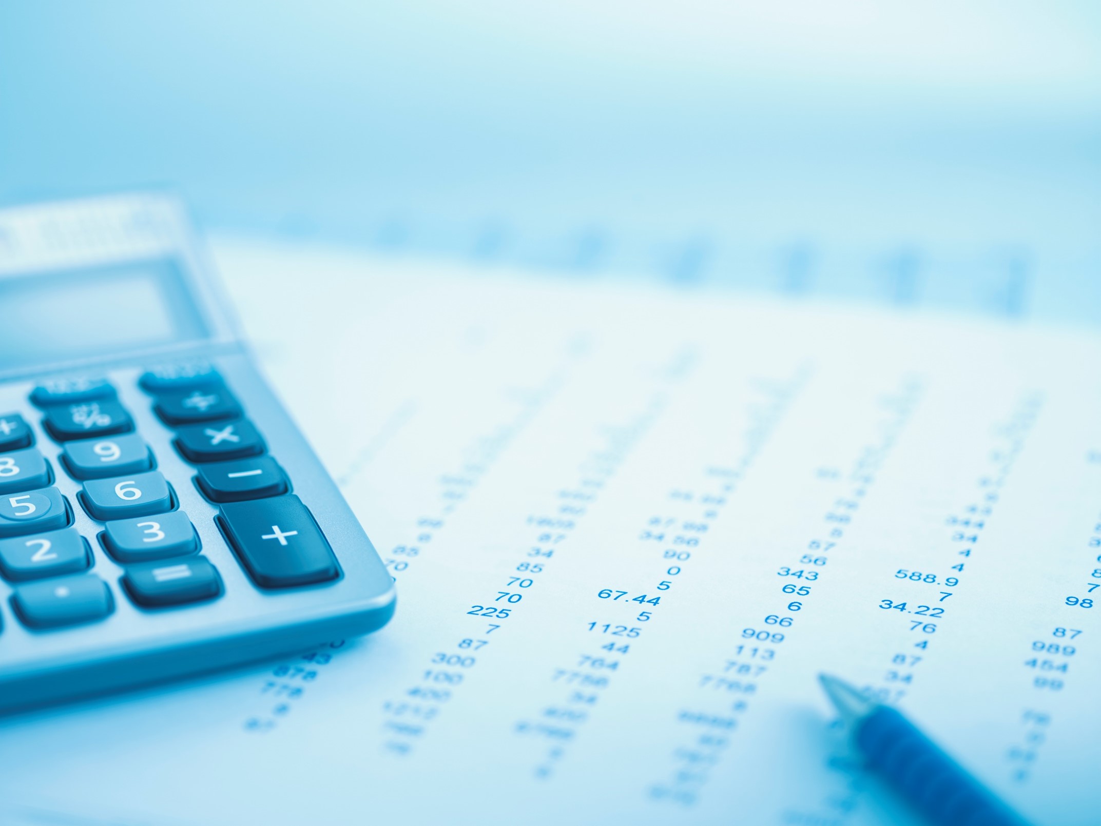 picture of calculator and pen on page with numbers