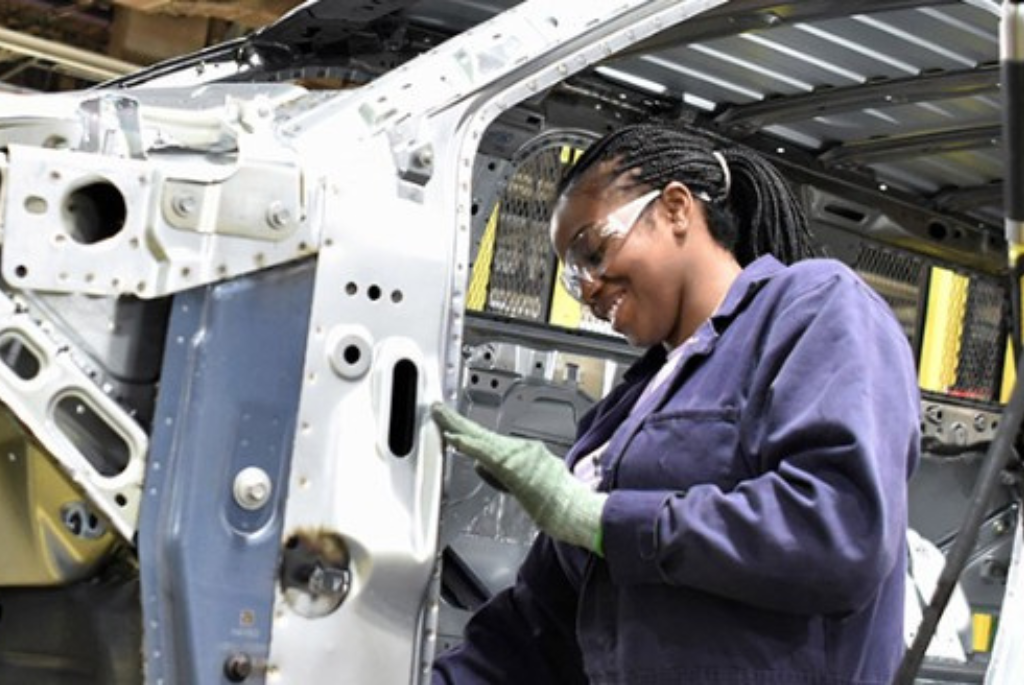 kctcs female student working on the body of a vehicle